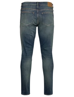 EVOLVE COMPASS - Tapered jeans